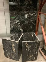 Two U-shaped granite bases shown front-on