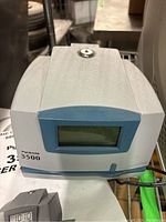 Front view of Pyramid 3500 time clock showing digital display and lock on top.