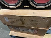 Photo of the sink box showing product label with dimensions, material, and country of origin.