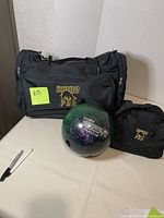 Photo showing 11 lbs Rhino Pro Power Groove reactive bowling ball with white lettering and Brunswick Rhino Pro branded black bowling ball bag and accessory pouch.