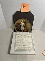 Bradford Exchange collectors plate with a girl sitting on a bench, certificate of authenticity visible in the box.