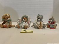 Set of 4 Calico Kittens figurines, all seated, photographed from front with white background.