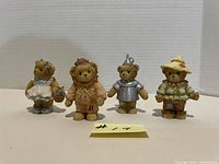 Full set of four Cherished Teddies Wizard of Oz figures displayed side by side