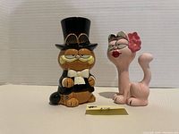Front view of Garfield and Arlene ceramic figurines, showing details and colors