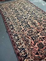 Angled top-down view of the full rug showing pattern and overall condition