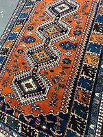 Full view of rug showing overall medallion design and color scheme