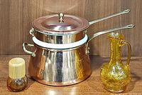 Copper and ceramic double boiler with lid shown with shaker and pitcher