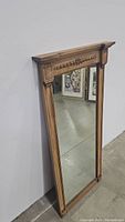 Full view of the vintage solid oak mirror with carved details, showing overall condition and design