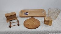 Complete set of light wood kitchen items including tray, recipe box, coasters with holder, cutting board, bowl holder, and metal basket.