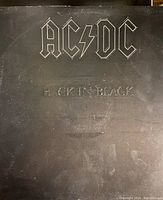 Front cover of AC/DC 'Back in Black' vinyl record showing album artwork and condition.