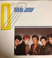 Front cover of Duran Duran vinyl album showing band photo and graphic design.