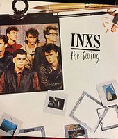 Cover of The Swing vinyl album showing the band members with a creative layout including art supplies.