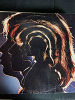 Cover artwork showing multiple layered profile silhouettes of band members for the Undercover album.
