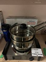 Single burner buffet range with coil element and stainless steel steamer pot stacked on top, showing overall lot contents