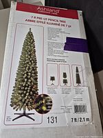 Box for Ashland 7 ft Pre-Lit Pencil Tree with detailed product information including lighting and assembly instructions.