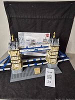 Completed Tower Bridge model with baseplate and instruction booklet displayed.