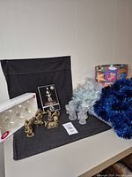 Photo showing the entire holiday lot with nativity set, glass ornaments, angel chimes box, candle holders, and garlands