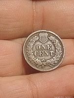 Reverse side of the 1900 Indian Head Penny showing the 'ONE CENT' inscription inside the laurel wreath and shield.