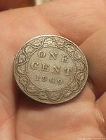 Reverse side of the 1909 Canadian large cent coin showing 'One Cent 1909' with decorative border