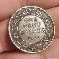 Reverse view showing denomination and maple leaf wreath.