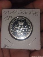 Obverse side of 1989 £2 sterling silver proof coin showing 'Tercentenary of the Claim of Right' design with crowned 'W' monogram and dates.