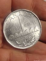 Reverse side showing The Big Nickel landmark and inscriptions with maple leaves