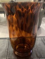 Front view of the vintage Murano hand blown tortoise shell pattern glass vase showing the coloration and shape.
