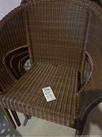 Front view of stacked chairs showing seating area and armrests