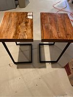 Two butcher block wood end/side tables with metal frame bases shown from above