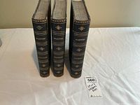 Set of three vintage Shakespeare hardcover books standing upright showing spines with titles: Histories, Tragedies, Comedies.