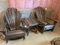 Front view of both chairs and table against basement wall showing overall set