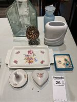 Photo showing all items including vanity pieces, vases, ornament, and jewelry box on table