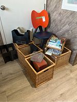 Photo of full lot showing chair, plastic file holders, woven baskets and smaller office items stacked on top.