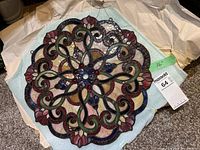 Stained glass panel resting on protective foam