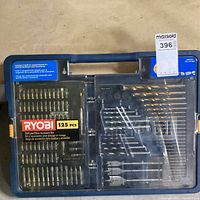 Top view of Ryobi 125-piece drill and drive accessory kit in hard case showing various bits and compartments.