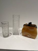 Three glass vases together: hobnail bubble pattern vase, Hoya crystal rectangular floral vase, amber purse-shaped vase