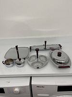 Complete set of Glo-Hill Canada chrome serveware displayed, showing all included items with Bakelite handles and glass inserts.