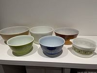 Full set of six vintage Pyrex mixing bowls showing various colors and patterns