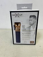 Box of MaxCut hair clipper set front showing product image and key features in English