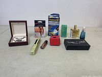 Full view of all items in the lot showing jewelry, skincare, and personal care products