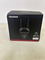 Front view of Toaioho QB320 Wi-Fi smart camera box showing product image and branding