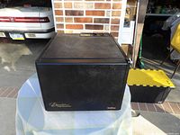 Front view of Excalibur food dehydrator in black on table.