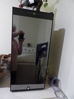 Front view of the black Ivation wine refrigerator with reflective glass door and locking mechanism.