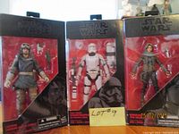 Front view of three boxed Star Wars Black Series 6-inch figures: Captain Cassian Andor, First Order Stormtrooper, Sergeant Jyn Erso, showing box wear and original packaging.