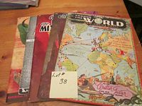 Five vintage art books laid flat on table, showing cover art and titles