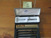 Parker two pens and ruler set inside black Parker branded case with foam insert
