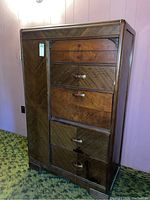 Front and angled views showing the antique wooden armoire with multiple drawers and a cedar-lined door on the left side.