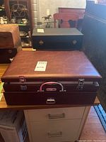 Leatherette cutlery case with metallic clasps and handle, showing the Casa Elite name plate on the front.