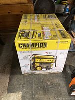 Front view of boxed generator showing Champion branding