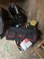 JobMate tool bag and DeWalt open-top tool carrier with tags, metal tool box and tool caddy in background